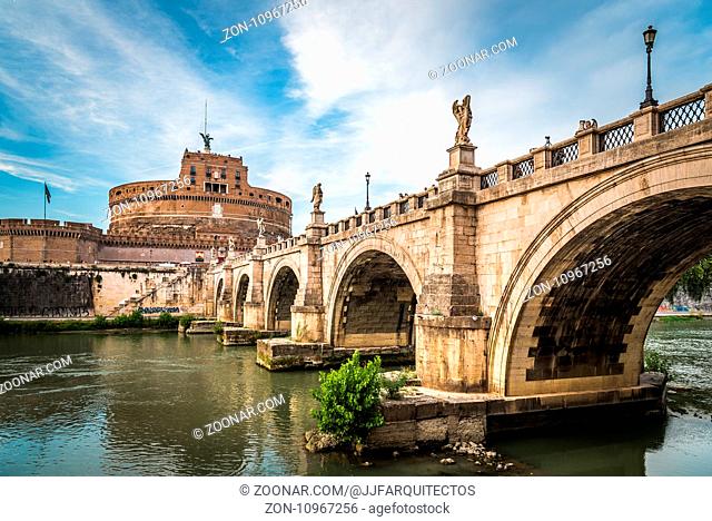 Rome, Italy - August 18, 2016: Bridge and Mausoleum Castel Sant Angelo at sunset. The Mausoleum of Hadrian, usually known as Castel Sant'Angelo is a towering...