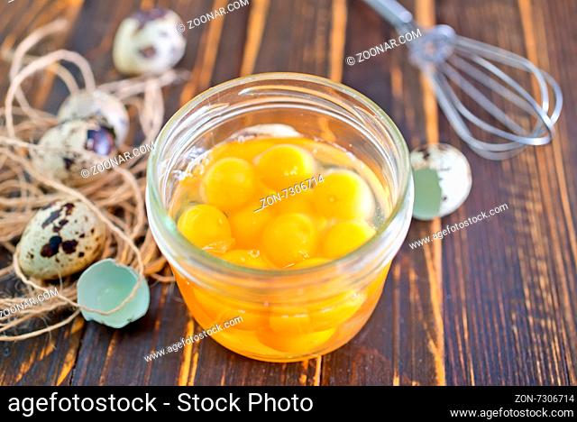 raw quail eggs in bank and on a table