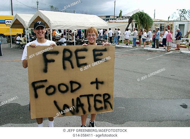 Claiming free food and water for victims, Hurricane Charley damage. Punta Gorda. Charlotte County, Florida, USA