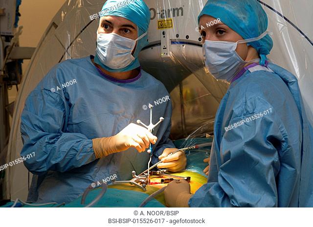 Reportage in the orthopedic surgery operating theatre in Pasteur 2 Hospital, Nice, France. Medullary liberation and arthrodesis in a patient suffering from...
