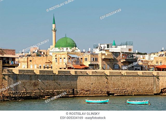 View on ancient walls, houses and mosques in old town of Acre Akko in Israel