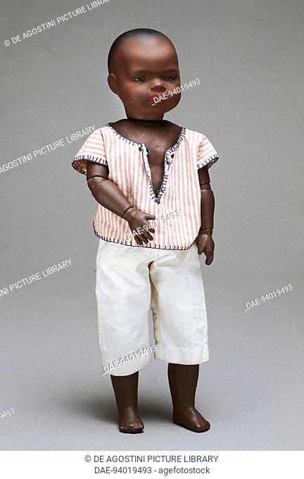 Character black baby doll, with bisque head, toy made by Gebruder Heubach. Germany, 20th century.  Milan, Museo Del Giocattolo E Del Bambino (Toys Museum)