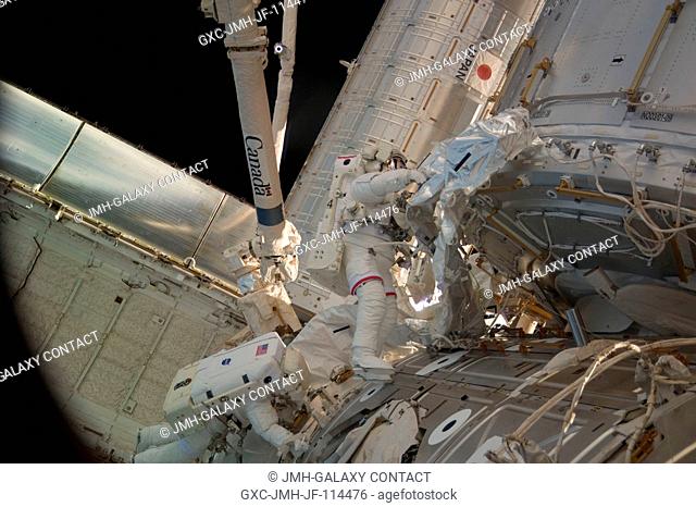 NASA astronauts Robert Behnken (right) and Nicholas Patrick, both STS-130 mission specialists, participate in the mission's second session of extravehicular...