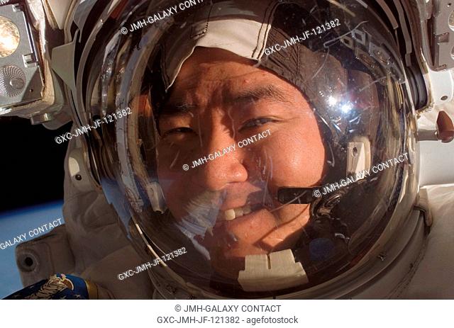The face of astronaut Daniel Tani, Expedition 16 flight engineer, is easily recognizable as he participates in a session of extravehicular activity (EVA) as...