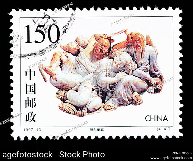 CHINA - CIRCA 1997: A Stamp printed in China shows the stone carving art of getting drunk into the innocence , circa 1997