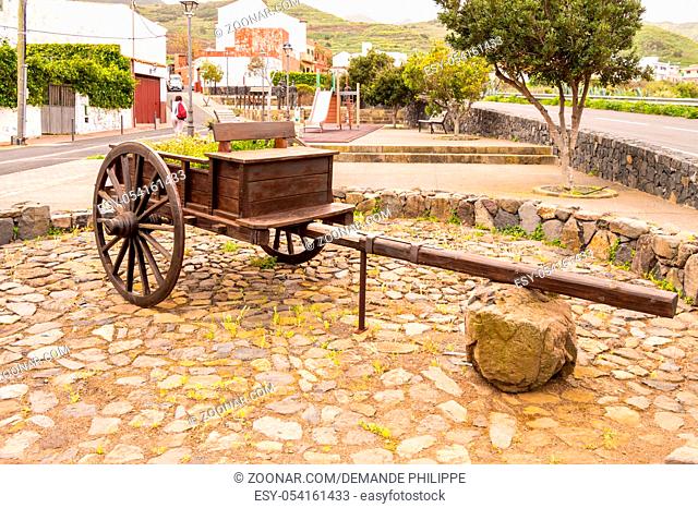 Old wooden transport cart transformed into a flowerpot in western Tenerife Spain