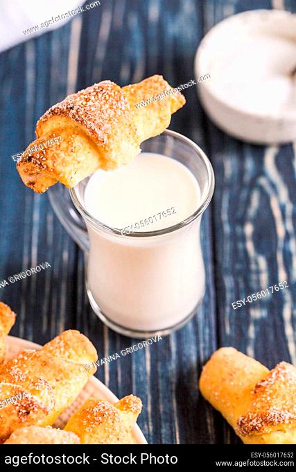 homemade cottage cheese mini croissants on a blue wooden background. breakfast with croissants