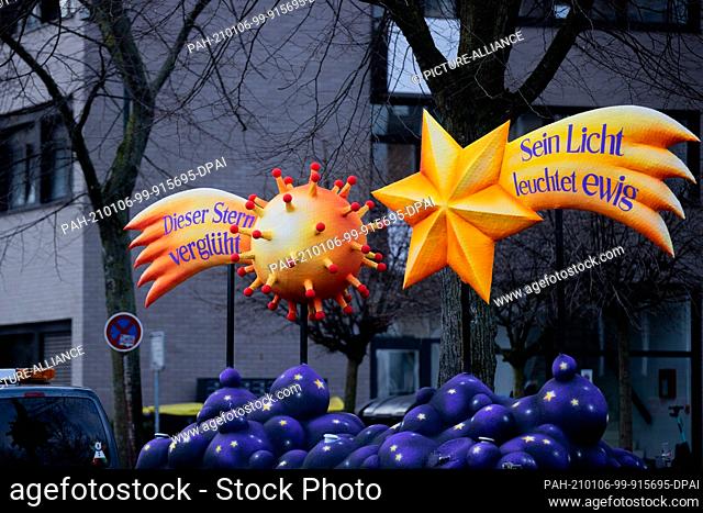 06 January 2021, North Rhine-Westphalia, Duesseldorf: A wagon from the Friedenskirche Ratingen, showing the Star of Bethlehem with the inscription ""Its light...
