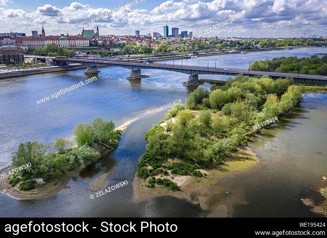 Vistula River and Slasko Dabrowski bridge in Warsaw city, Poland, view with Royal Castle on background