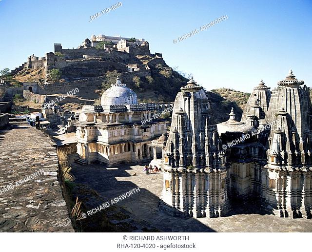 Temples in the foreground with the Badal Mahal Cloud Palace on hilltop, Kumbalgarh Fort, Rajasthan state, India, Asia