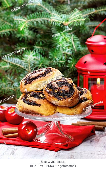 Poppy seed buns on cake stand. Christmas eve setting, traditional arrangement