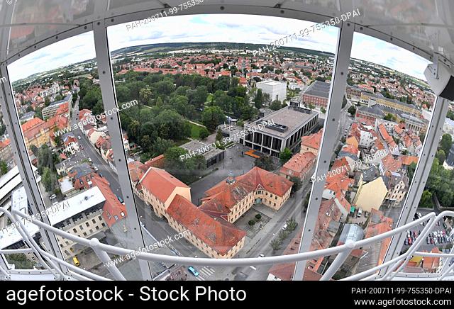 11 July 2020, Thuringia, Weimar: The old town with its music school, Weimarhalle and Bauhaus Museum can be seen from the approximately 80-metre high mobile...