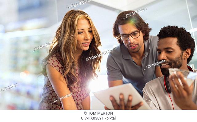 Creative business people using digital tablet
