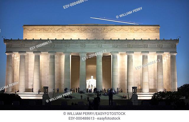 Airplane Over Lincoln Memorial White Statue Evening Washington DC Faces Blurred by Long Exposure