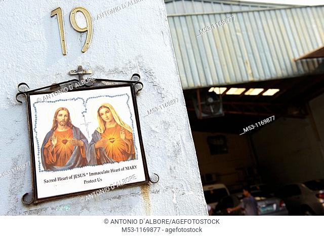 Religious ceramic tile depicting the Sacred hearth of Jesus and Immaculate heart of mary outside a commercial outlet in Mandaluyong City  Metro Manila...
