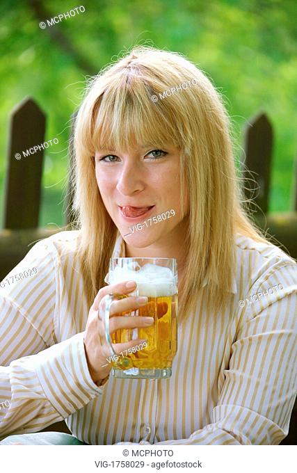 Woman with a beer glass - 01/01/2009