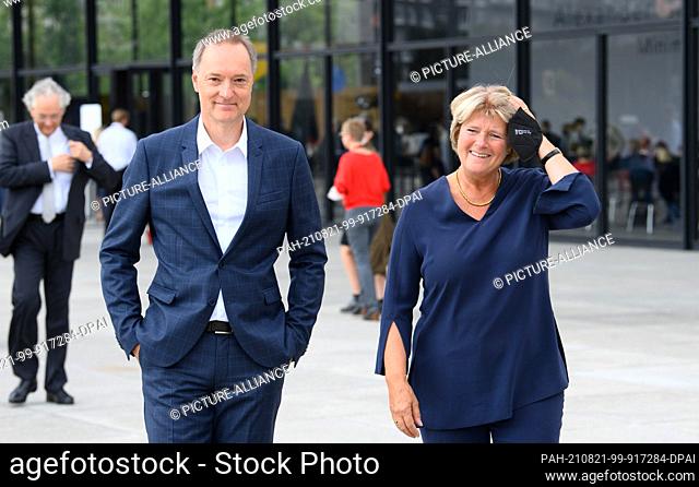 21 August 2021, Berlin: Joachim Jäger, director of the Neue Nationalgalerie, and Minister of State for Culture Monika Grütters (CDU) attend the ceremony marking...