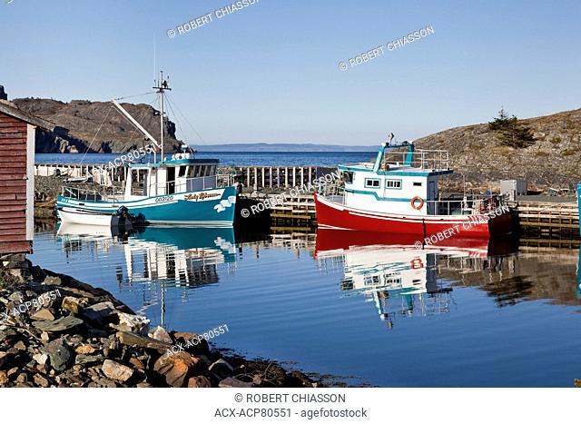 Two Cape Islander fishing boats moored in small harbour in Brigus, Newfoundland