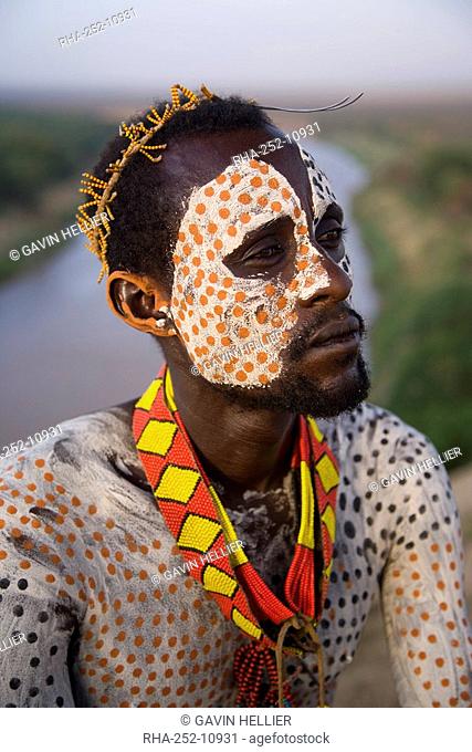 Portrait of a Karo tribesman with facial decoration in chalk imitating the spotted plumage of the guinea fowl, Lower Omo Valley, Ethiopia, Africa