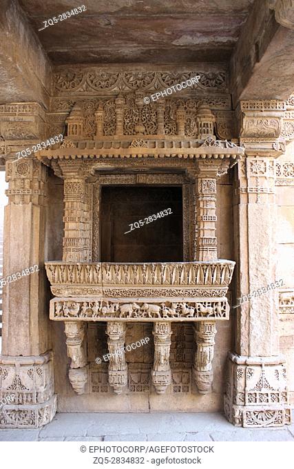 Intricate carvings and beautiful border patterns engraved on a balcony in Adalaj ni Vav, Adalaj Stepwell, Ahmedabad, Gujarat, India