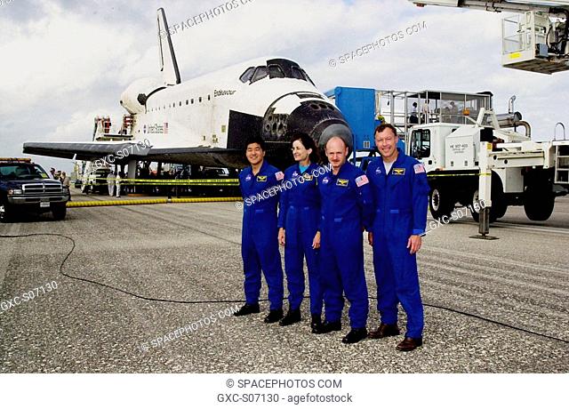 12/17/2001 -- After a successful return to Earth aboard orbiter Endeavour background, the STS-108 crew pose for a photo. From left are Mission Specialists...