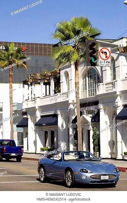 United States, California, Los Angeles, Beverly Hills, luxury car at the intersection of Little Santa Monica Blvd and Rodeo Drive