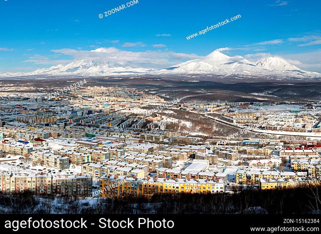 Winter landscape residential buildings of Petropavlovsk-Kamchatsky City, scenery volcanoes of Kamchatka Peninsula: Koryak Volcano, Avacha Volcano