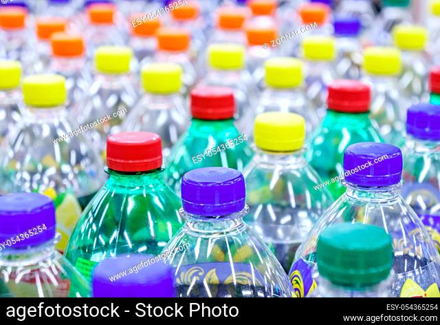 Image of many plastic bottles with water in a shop