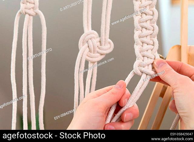 Different macrame knots. Woman making macrame at home. Stay at home hobbies