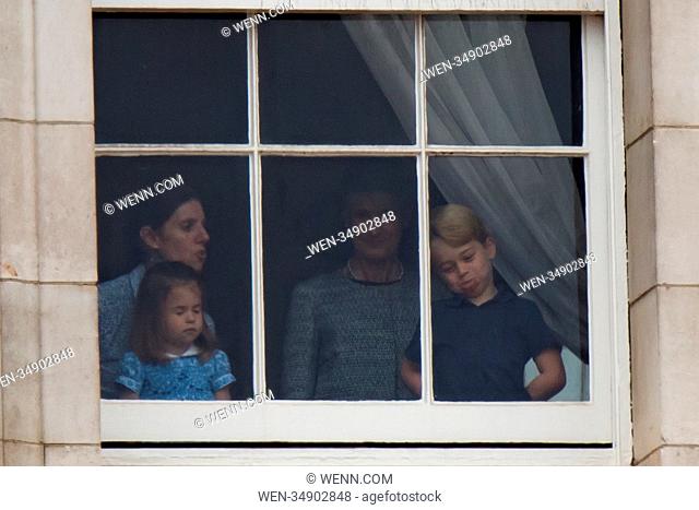 Incredibly cute photos of Princess Charlotte and Prince George show the two young royals having fun at a window in Buckingham Palace