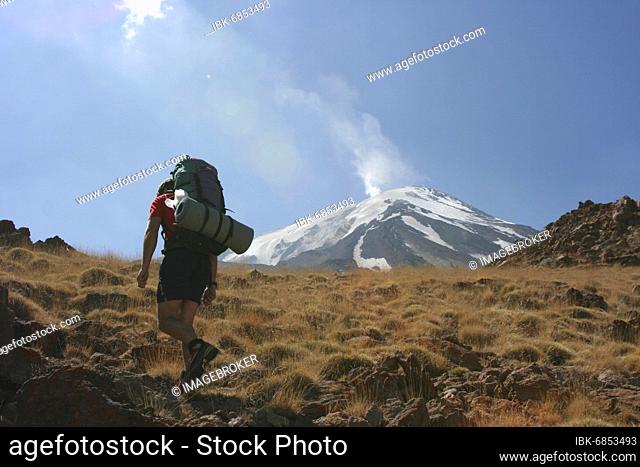 Ascent to the highest volcano in Asia, Damavant, the plume of smoke at the summit is clearly visible, Iran, Asia