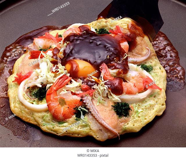 Japanese pancake with seafood and vegetables