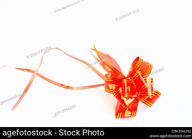 Chinese red auspicious knot isolated on a white background, used for the decorations of wedding invitation cards or new year cards.Blank for text