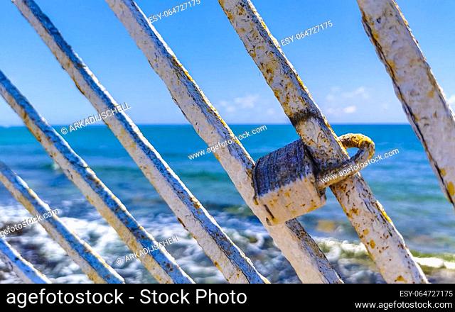 Lock on metal railing on beach in Playa del Carmen Quintana Roo Mexico