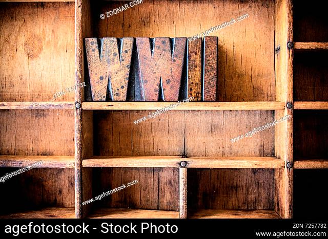 The word WWII written in vintage wooden letterpress type in a wooden type drawer