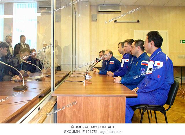 The prime and backup crews for Expedition 22 meet with Russian space officials after inspecting their Soyuz TMA-17 spacecraft one final time on Dec