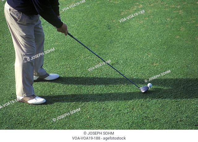 Golfer from waist down preparing, Ojai, CA