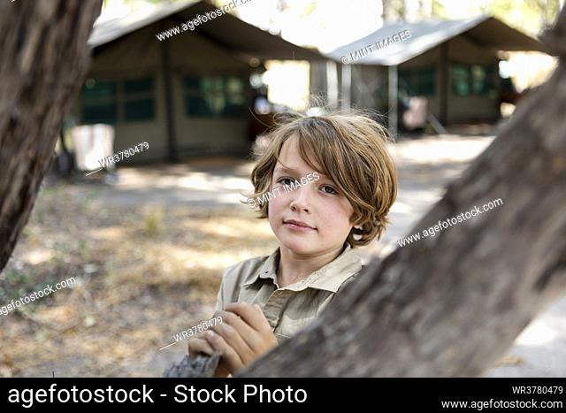 young boy in tented camp, Okavango Delta, Botswana