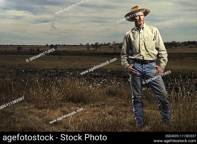 Farmer standing in field