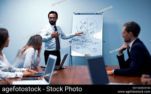 Supervisor discuss with team finance and communication planning concept sitting in the meeting or conference room. Business people meeting at the office to...