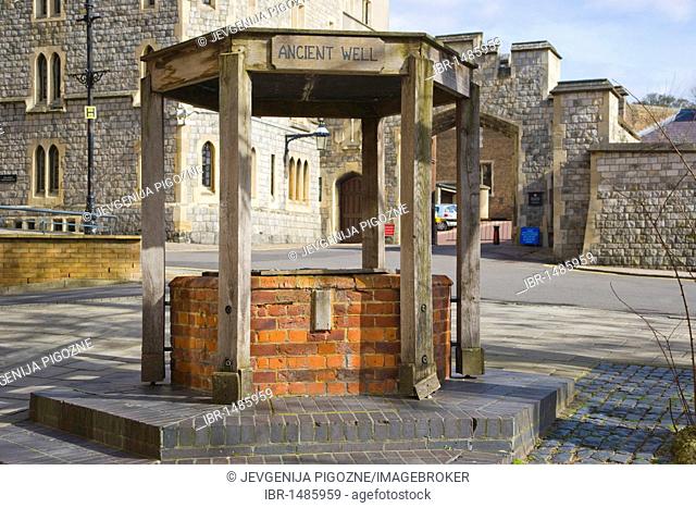 Ancient well against the forecourt of The Royal Mews, St Alban's Street, Windsor Castle, Berkshire, England, United Kingdom, Europe