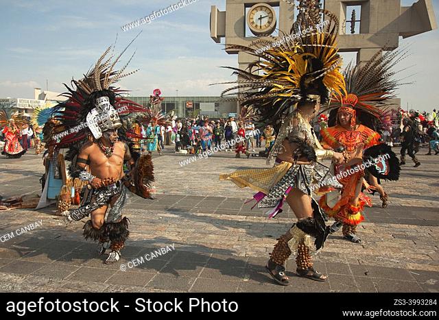 Indigenous dancers wearing masks performing during the celebrations in front of the Basilica on the festival day dedicated to Our Lady of Guadalupe at Plaza De...