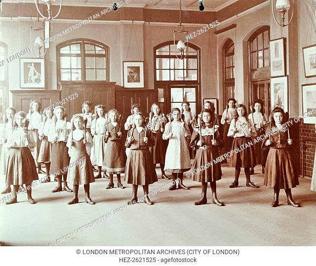 Girls holding Indian clubs, Cromer Street School/ Argyle School, St Pancras, London, 1906. Artist: Unknown