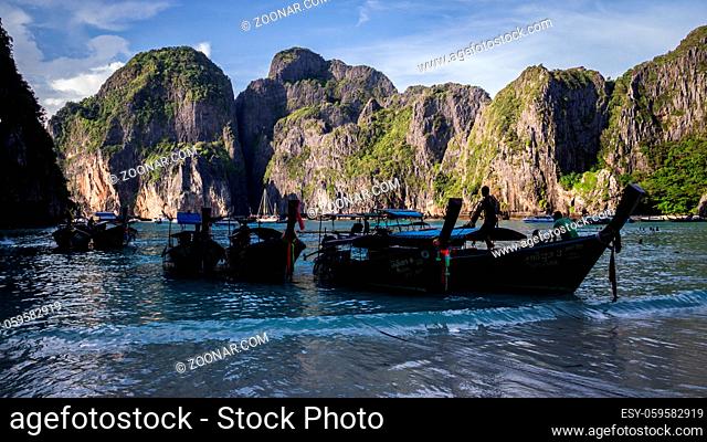 Ko Phi Phi Leh Island, Thailand on November 17, 2016: Longtail boats waiting for passengers at the beach at Maya Bay
