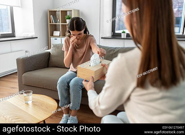 crying woman and psychologist at psychotherapy