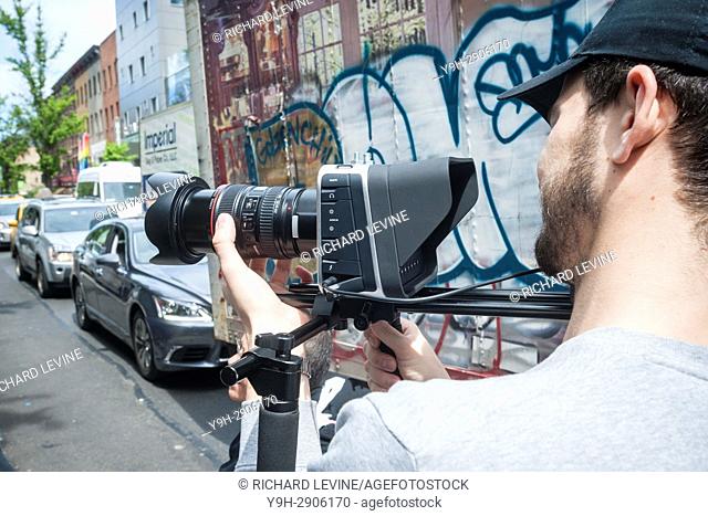 A videographer uses a Blackmagic camera in New York