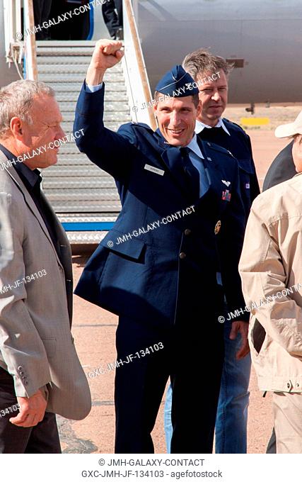 Expedition 3738 Flight Engineer Michael Hopkins of NASA provides a fist pump Sept. 13 after his arrival at an airport in Baikonur