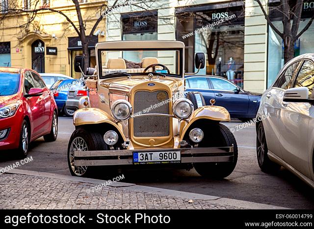 Prague, Czech Republic - March 17, 2017: An antique car, which is used for sightseeing tours, parked in the historic city centre