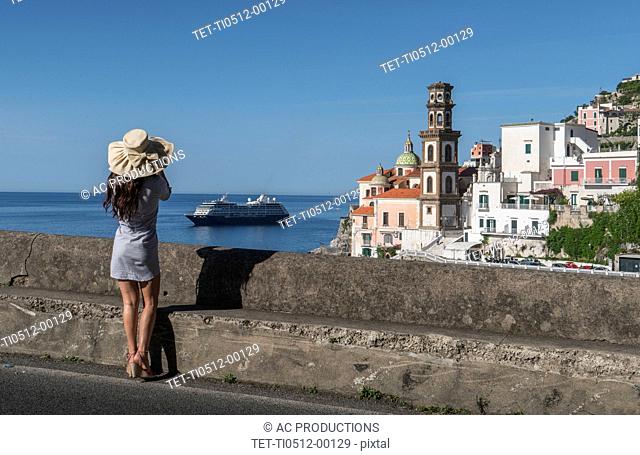 Woman wearing hat by Atrani, Italy