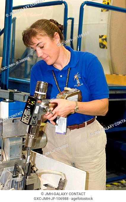 Astronaut Heidemarie M. Stefanyshyn-Piper, STS-115 mission specialist, participates in an extravehicular activity (EVA) drive lock assembly (DLA)...
